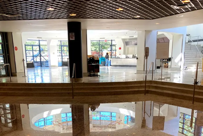 A lobby with flood water pooled on the floor